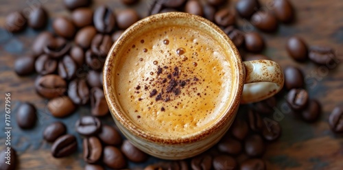 a coffee cup with coffee beans on top