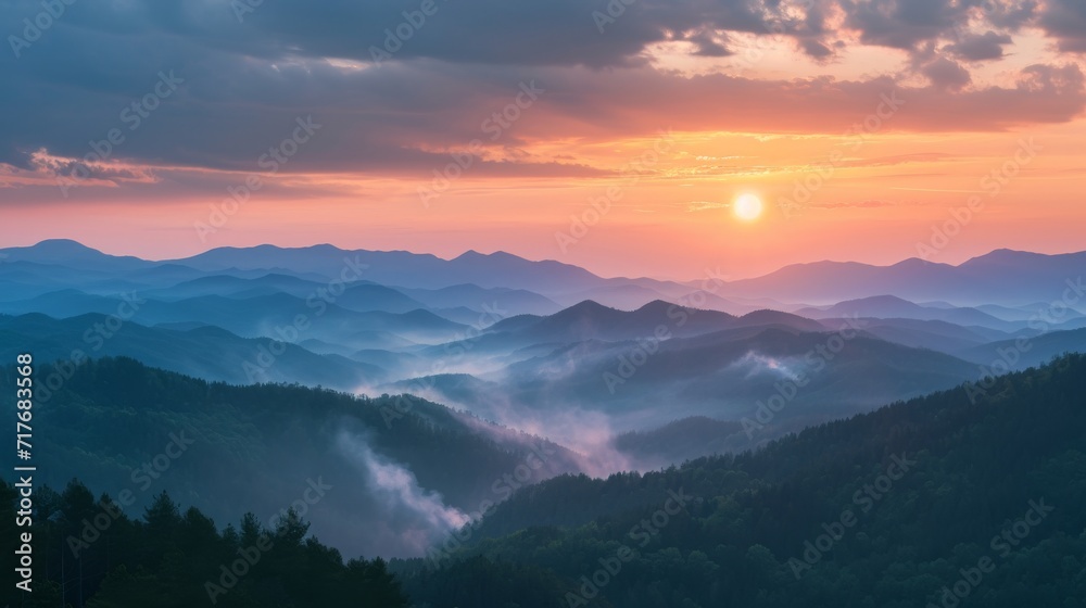 Smoke cascading over a mountain range at sunrise background