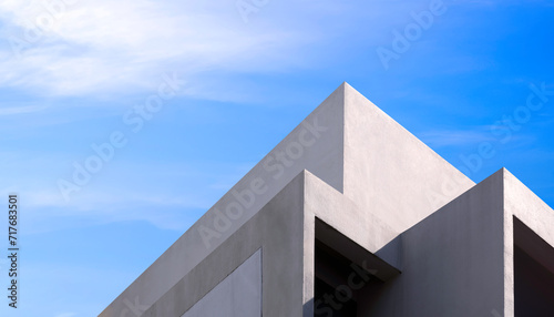 Modern geometric building against blue sky in low angle and perspective side view, Exterior architecture background in street minimal style