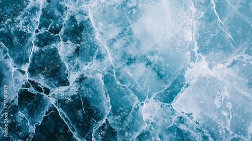 Top-down view of a frozen lake with intricate ice patterns background.