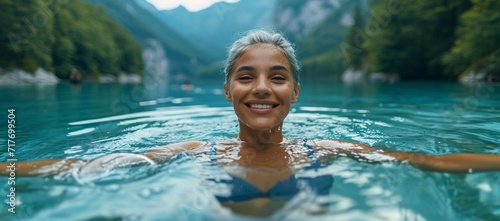 July's Hottest Swimwear: A Woman in a Bikini Smiling in the Ocean Generative AI photo