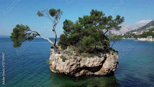 The symbol of Brela, The Brela Stone. This rock in the sea, overgrown with pines, shows the strength and power of survival and growth from the stone itself. Natural beauty.