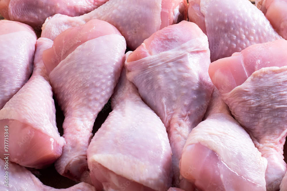 Raw chicken drumsticks. Chicken meat background. Close up. Raw chicken drumsticks. Chicken meat background. Close up.