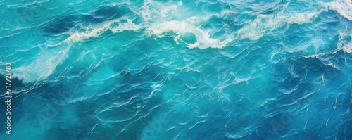 Sea waves or ocean surface from aerial view. Blue water with foam, copy space for text. photo