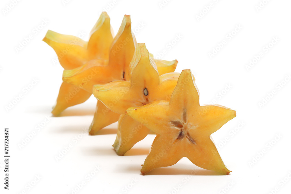 Fototapeta premium Sliced fresh organic star fruit delicious isolated on white background clipping path