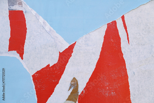 Paper background scraps of red and blue paper, shreds of torn billboard