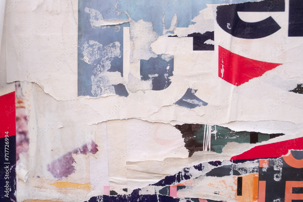 Fototapeta premium Torn and ripped street poster background, abstract paper collage