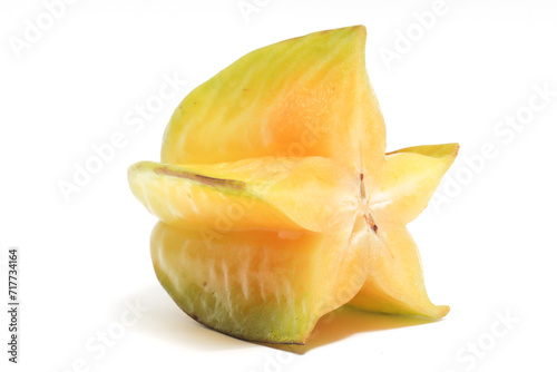 Half cut fresh organic star fruit delicious side view isolated on white background clipping path