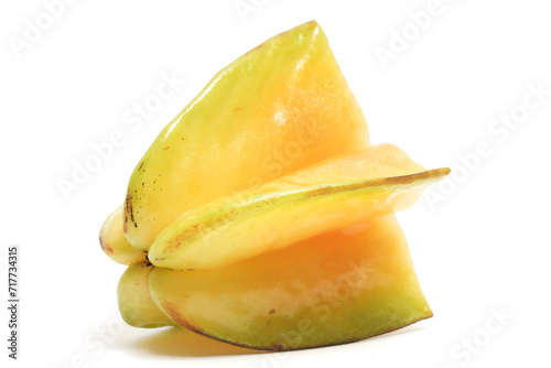 Half cut fresh organic star fruit delicious side view isolated on white background clipping path