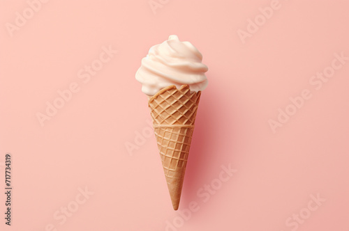 Minimalistic ice cream in a waffle cone on a pink background