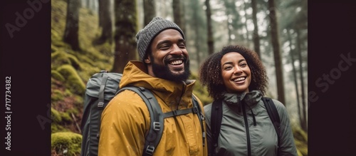 Portrait, smile and black man hiking in the forest together with his wife for travel, freedom or adventure. Earth, nature or environment with a happy husband in the woods to explore the wilderness