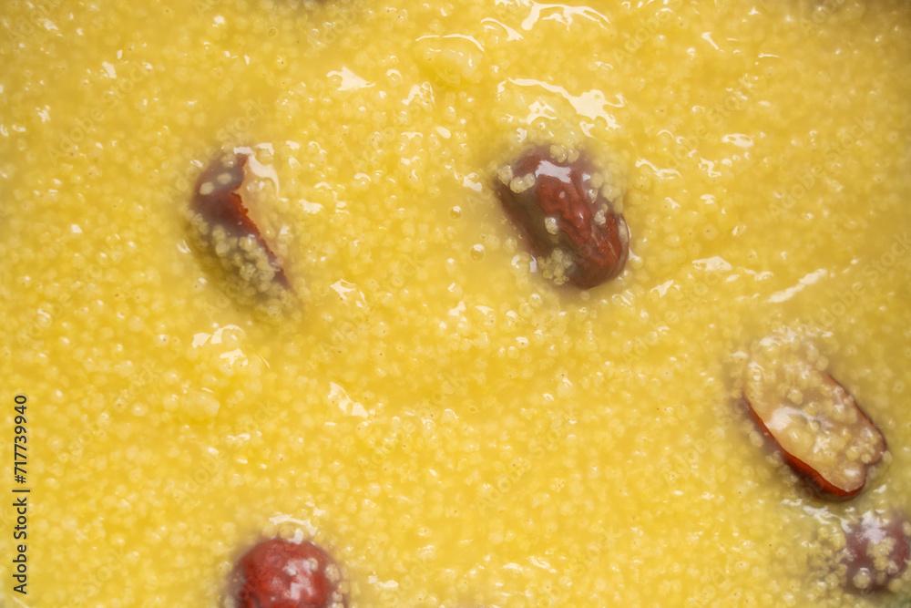 millet congee or millet porridge with jujube in pot millet congee or millet porridge with jujube in pot
