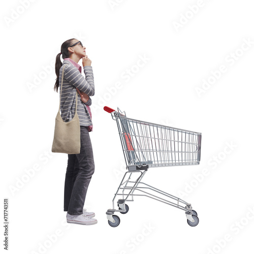 Foto Woman standing behind a trolley and thinking