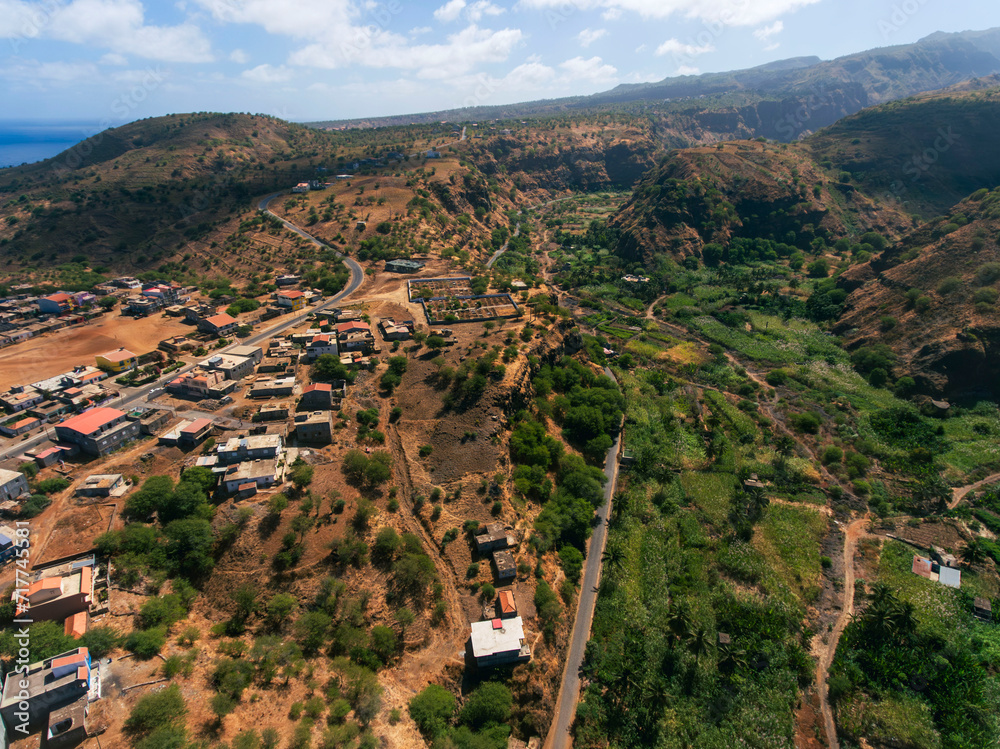 Obraz premium Barragem Principal in Santiago Island, Cape Verde, water dam view from the top of the mountain, view of the sea, mountains and small village.
