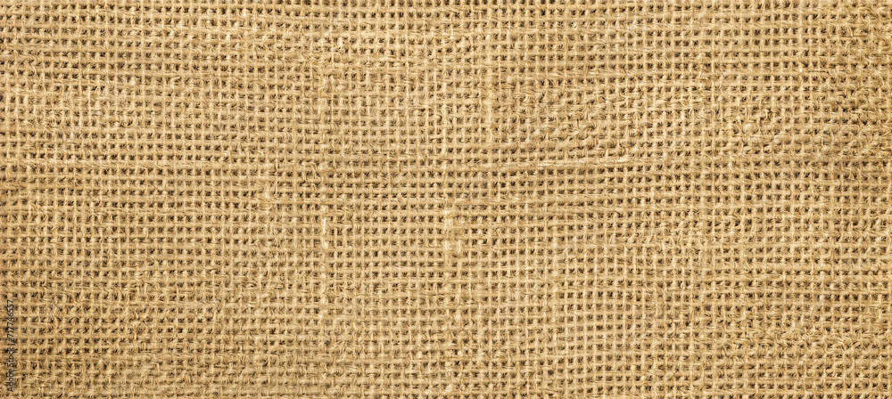 Jute hessian sackcloth canvas sack cloth woven texture pattern background in yellow beige cream brown color Jute hessian sackcloth canvas sack cloth woven texture pattern background in yellow beige cream brown color