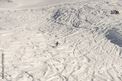 Freeride powder, snowboarding in Les deux alpes resort in winter, mountains in French alps, Rhone Alpes in France Europe