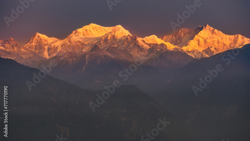 A view of Snow clad Kangchenjunga, also spelled Kanchenjunga, is the third highest mountain in the world. It lies between Nepal and Sikkim, India, photo