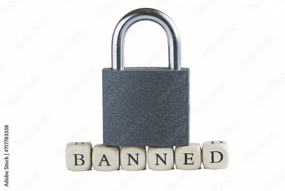 Inscription banned next to a closed padlock. White background. Concept of banned internet forum, chat room, account, internet restriction. Photo. Inscription banned next to a closed padlock. White background. Concept of banned internet forum, chat room, account, internet restriction. Photo.