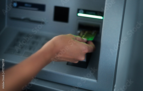 Woman using banking machine