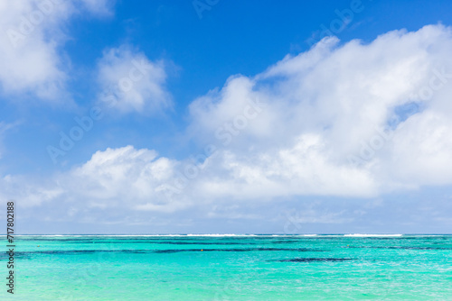 Anse Royale beach, Seychelles. Coastal view with ocean water under blue sky © evannovostro