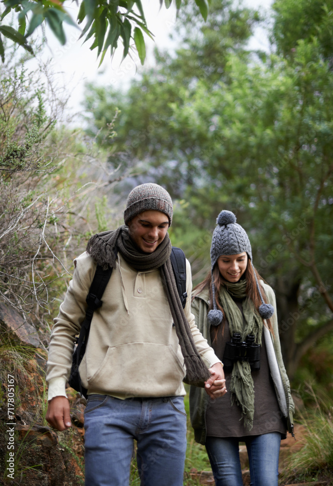 Couple, happy and hiking in forest or holding hands with travel, adventure and nature for wellness or fitness. Man, woman and trekking in woods for cardio, exercise or workout with view or backpack Couple, happy and hiking in forest or holding hands with travel, adventure and nature for wellness or fitness. Man, woman and trekking in woods for cardio, exercise or workout with view or backpack