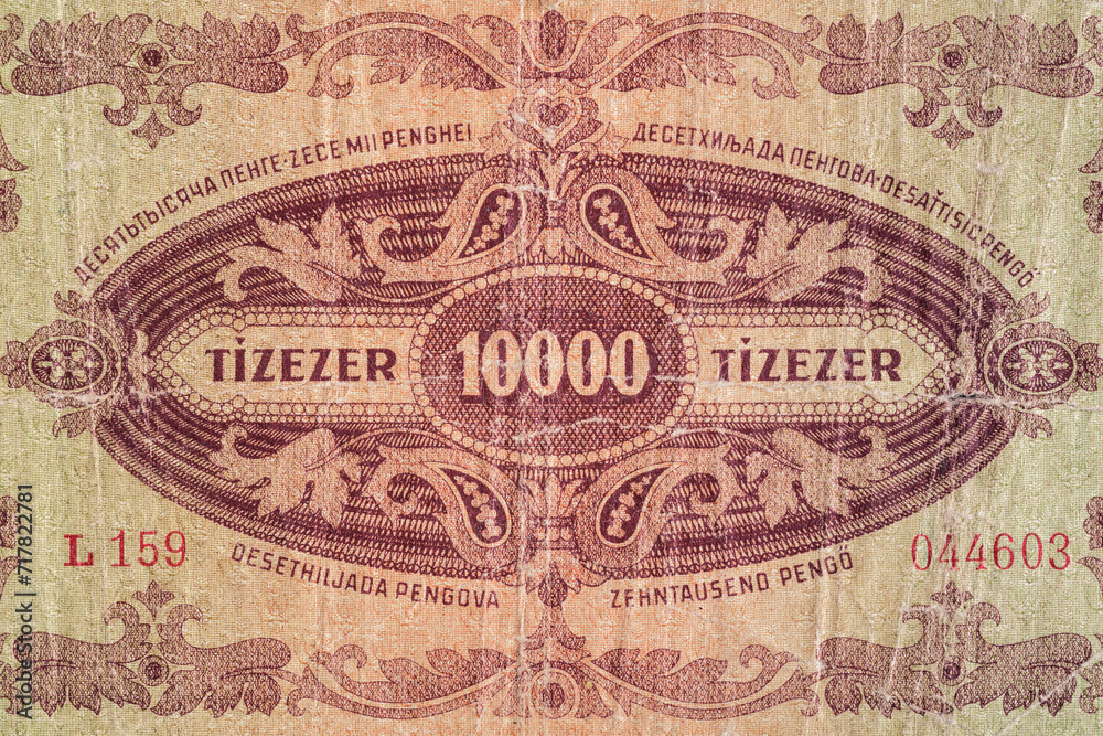 Vintage elements of old paper banknotes.Bonistics.Hungarian banknote at 10000 pengos, 1945 year.Fragment  banknote for design purpose.