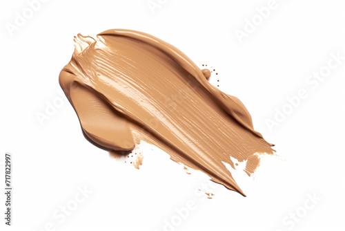 Beige stroke swatch of makeup foundation isolated on white background