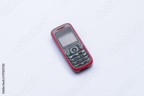 Old cell phone on white background, vintage cell phone