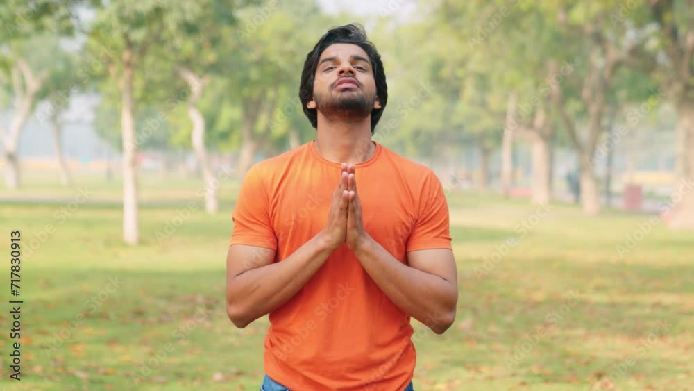 Young Indian Man Praying to God Young Indian Man Praying to God