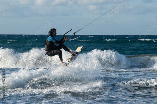 Kite surfing.Windsurf.Kite boarding. To fly a kite. Surfers of all ages train in the Mediterranean. Flying a kite on the beaches of Cyprus. © osman