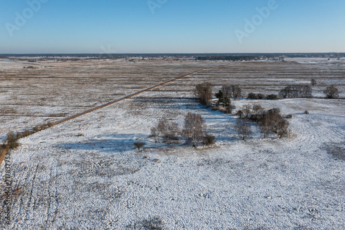 Принти на полотні Fields, meadows and pasture covered with snow in winter in Poland