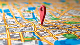 Travel and Navigation Concept: Close-up of a Map with a Red Pin, Symbolizing Journey and Destination
