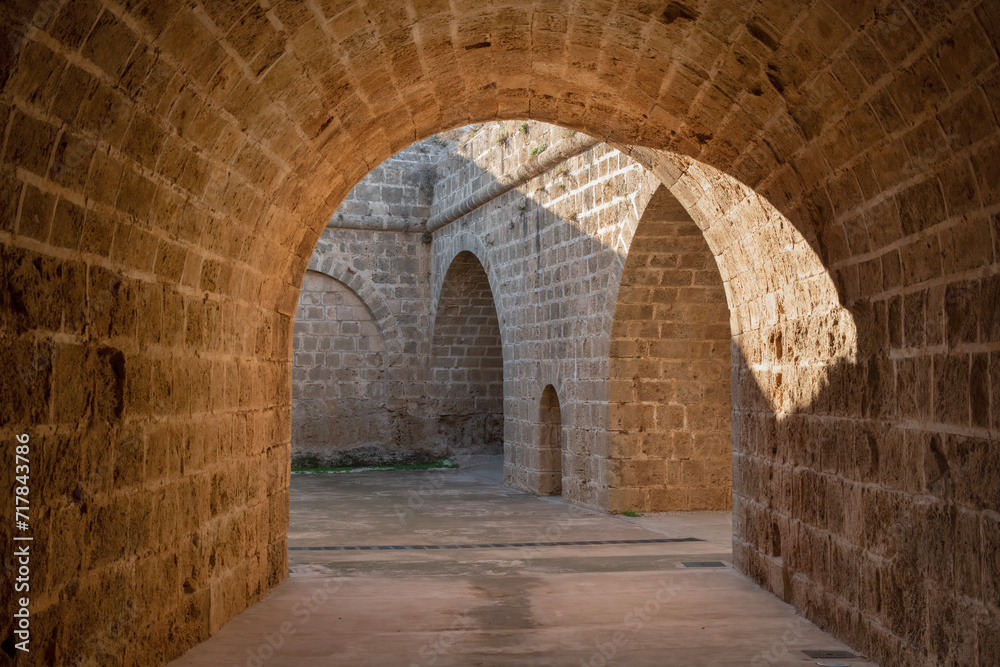 Tunnel passages and walls made of cut stone under Othello Castle. Cyprus historical places.