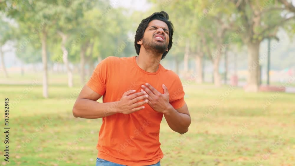 Young Indian Man Having Heart Attack Young Indian Man Having Heart Attack