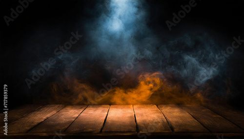 Black background, an empty wooden table with smoke floats up. Empty space for displaying products