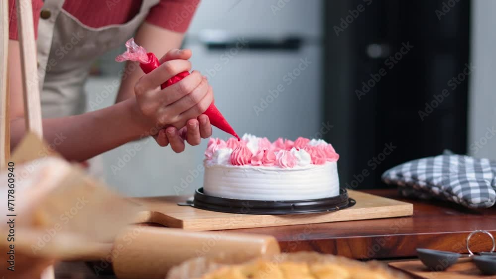 Homemade, happy relaxing and wellness at home. Young asian man and woman preparing birthday cake for friends Homemade, happy relaxing and wellness at home. Young asian man and woman preparing birthday cake for friends