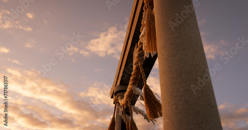 Canvas Print Torii gate, sunset and sky in Japan with clouds, zen and spiritual history on travel adventure