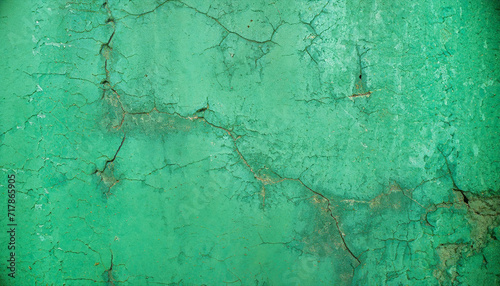 Background old wall emerald, green with cracks.