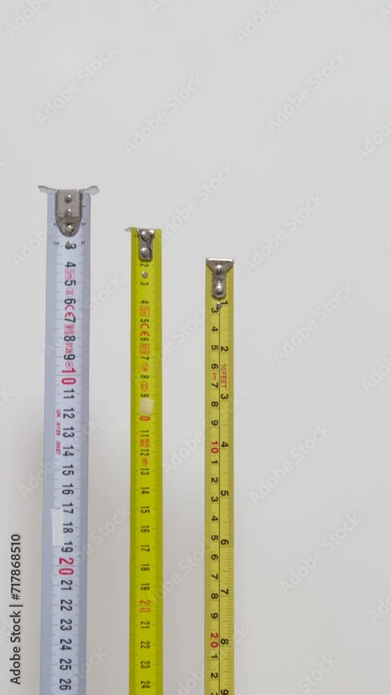 Using measuring tape to check dimensons of furniture Detail of numbers on a ruler apples are unlikely advertising Green background chromakey copy space Using measuring tape to check dimensons of furniture Detail of numbers on a ruler apples are unlikely advertising Green background chromakey copy space
