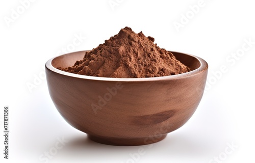 Wooden bowl containing cocoa powder in the photo on a white background