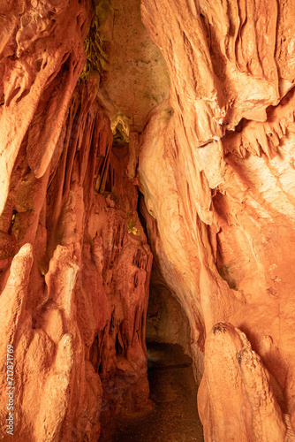 Underground interior of the Coin Cave with lake, stalactites, stalagmites and other rock formations.Vila de Ourém