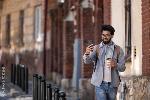 Brunette young hindu man making pictures in the street © zinkevych