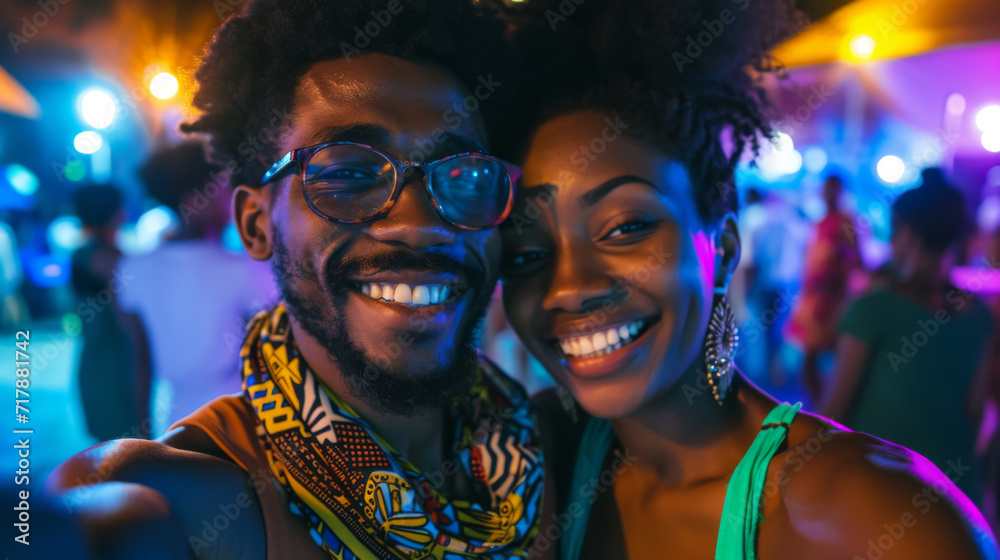 selfie of a young couple embracing and smiling joyfully at the camera with bright city lights selfie of a young couple embracing and smiling joyfully at the camera with bright city lights