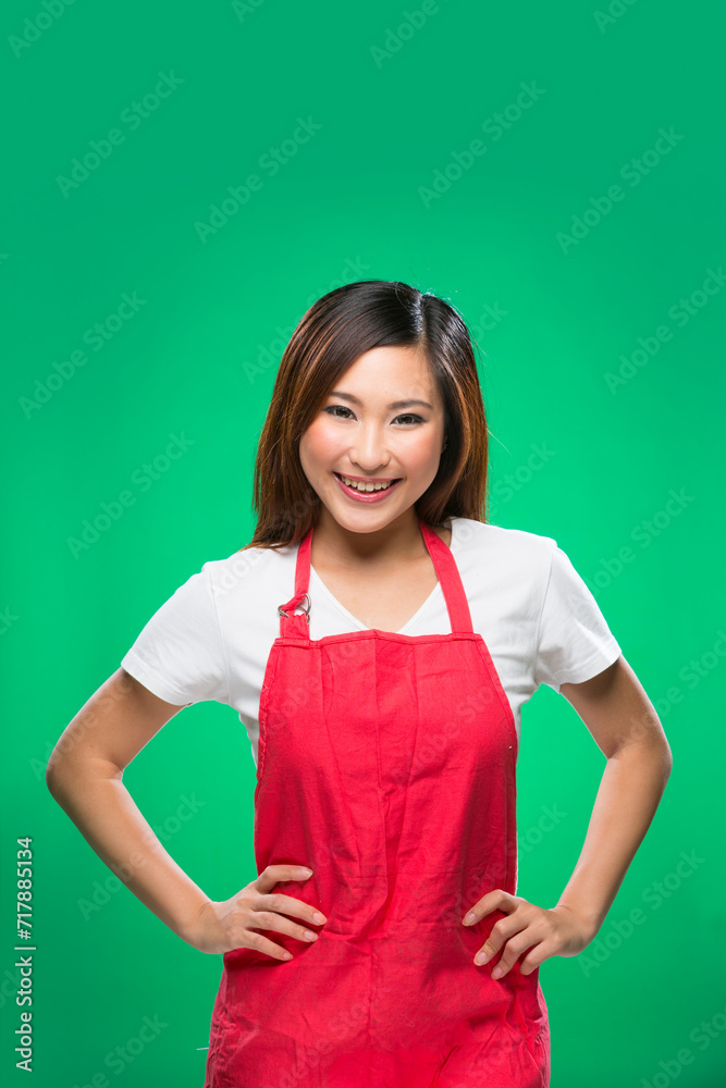 Happy Asian Woman wearing a red apron. Happy Asian Woman wearing a red apron.