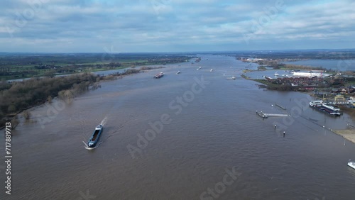 Aerial view of cargo vessels and ships sailing through wide part of the Rhine near Lobith, during extremely high water levels in the Netherlands
 photo