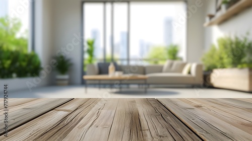 Wooden table with blurred modern apartment interior background  room with wooden floor and window
