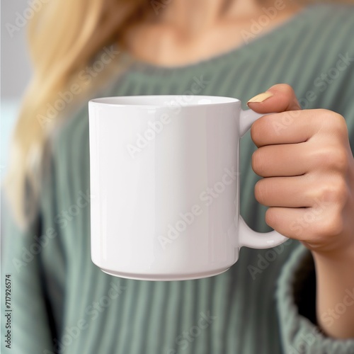 Close up of a female hand holding a white mug with copy space. AI.