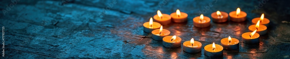 A banner with a wide shot of heart-shaped candle arrangement on a rustic blue background, casting a warm, inviting glow for Valentine's day A banner with a wide shot of heart-shaped candle arrangement on a rustic blue background, casting a warm, inviting glow for Valentine's day