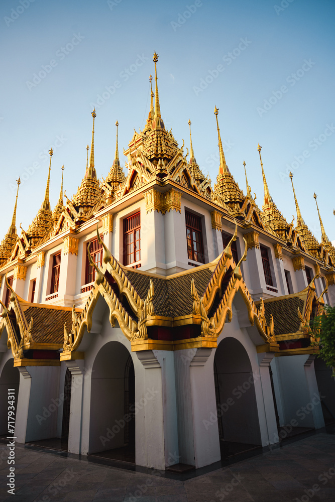 Stunning view of the Wat Ratchanatdaram, a beautiful Buddhist temple that stands proud in the heart of downtown Bangkok, Thailand.