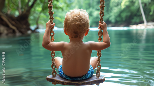 young child on a rope swing by a peaceful river, surrounded by lush greenery